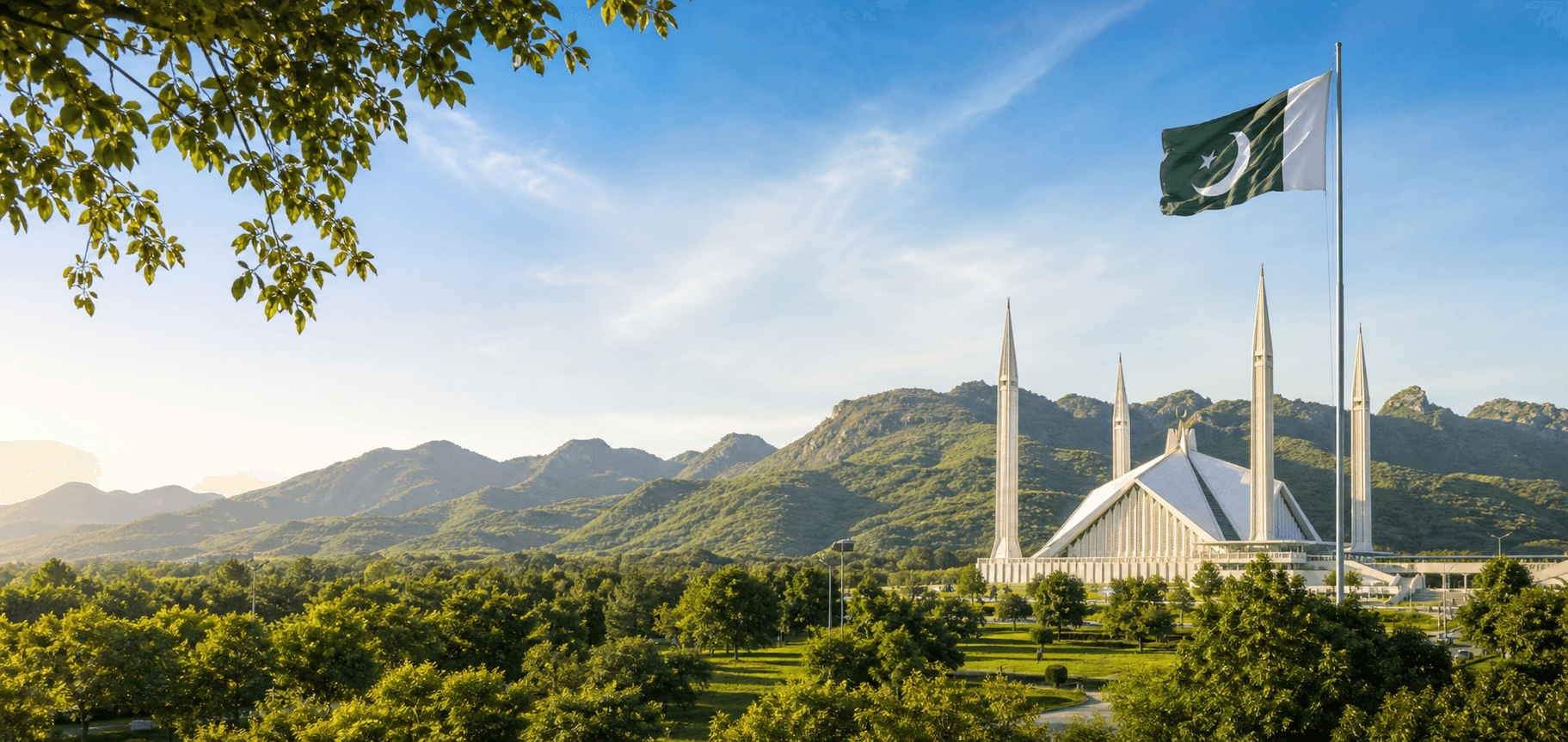 Faisal Mosque beneath the Pakistan flag and Margalla Hills